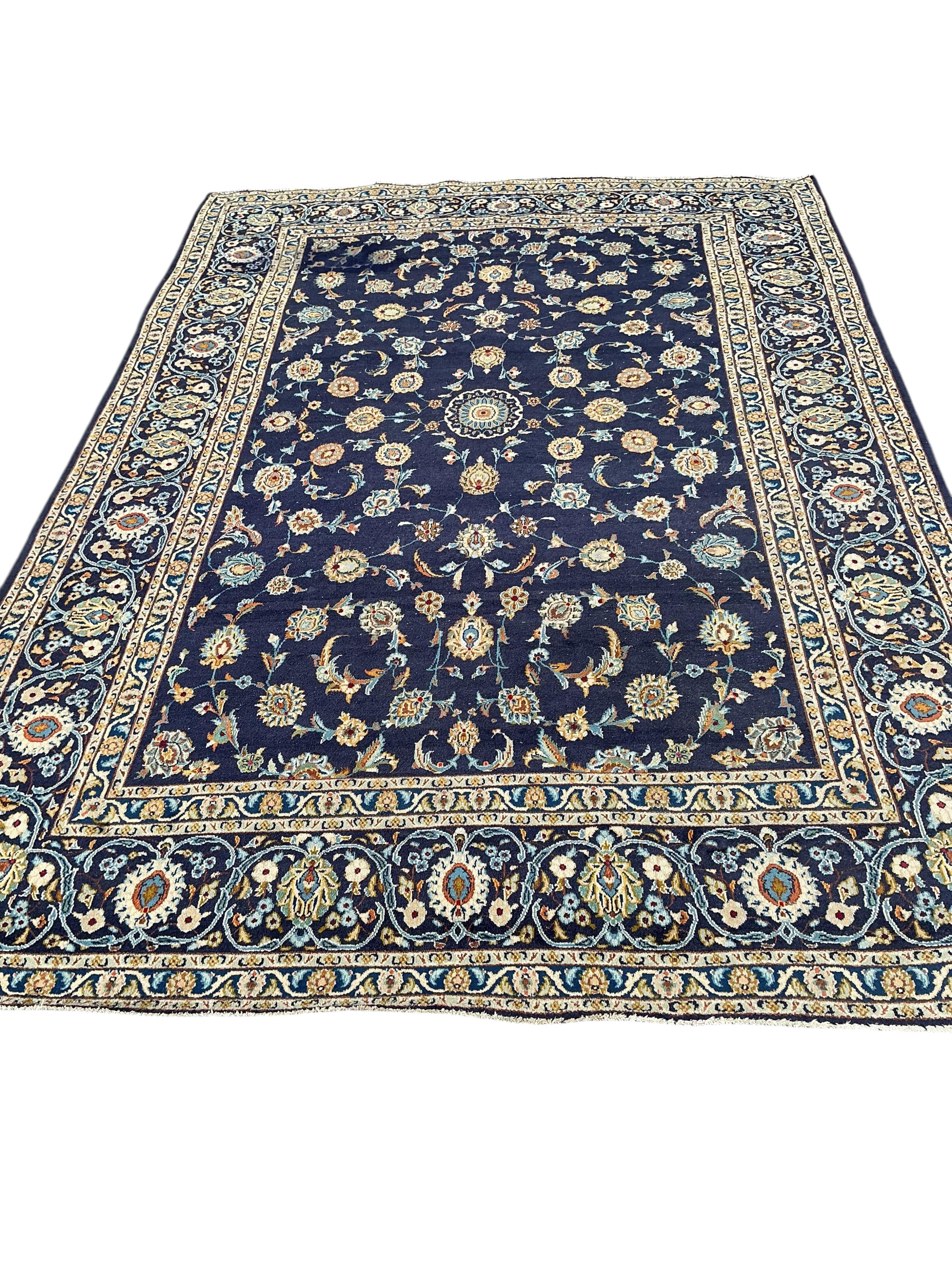 A Tabriz ground carpet, 330 x 219cm